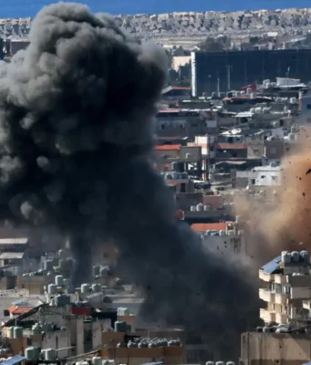 Guerra Iran, raid su Beirut e missili su Israele: morta una coppia. Nuova escalation in Medio Oriente Beirut bombardamenti guerra Iran